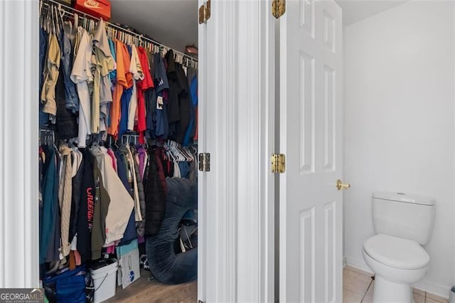 1657 Bradmere Ln, Lithia Springs, GA 30122 - bathroom featuring a walk in closet and tile patterned floors
