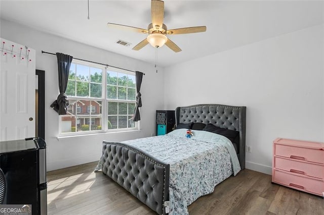 1657 Bradmere Ln, Lithia Springs, GA 30122 - bedroom with wood finished floors and ceiling fan