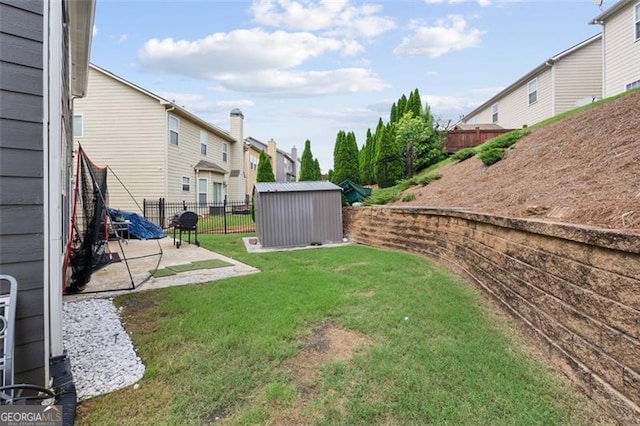 1657 Bradmere Ln, Lithia Springs, GA 30122 - fenced backyard with a patio, a storage unit, and a residential view