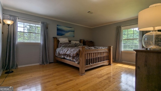 67 Wilder Dr, Forsyth, GA 31029 - bedroom featuring light wood finished floors and ornamental molding