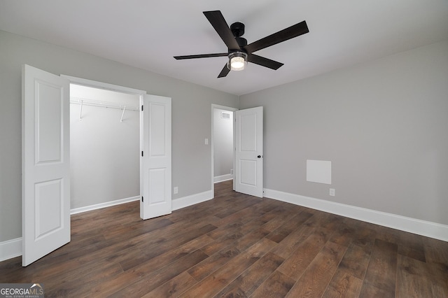 858 Pates Creek Rd, Stockbridge, GA 30281 - unfurnished bedroom with dark wood finished floors, a closet, and a ceiling fan