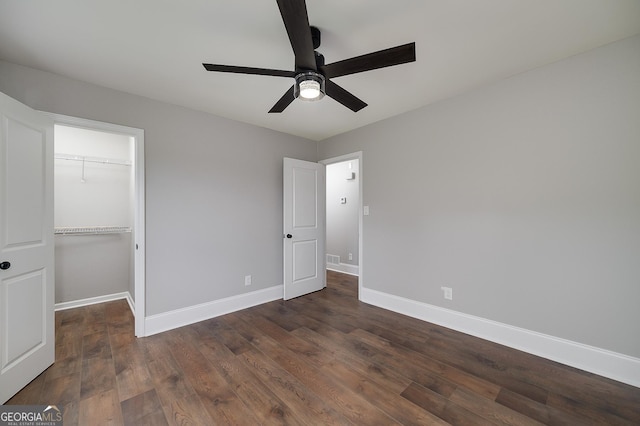 858 Pates Creek Rd, Stockbridge, GA 30281 - unfurnished bedroom with wood finished floors, a closet, a walk in closet, and ceiling fan