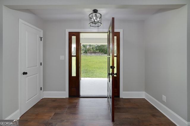 858 Pates Creek Rd, Stockbridge, GA 30281 - foyer featuring a chandelier and dark wood-style floors