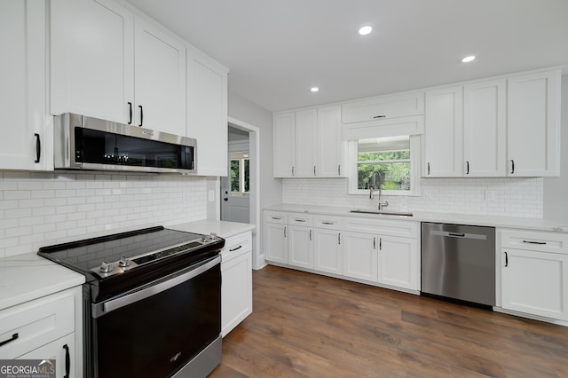 858 Pates Creek Rd, Stockbridge, GA 30281 - kitchen with appliances with stainless steel finishes, decorative backsplash, light countertops, and recessed lighting