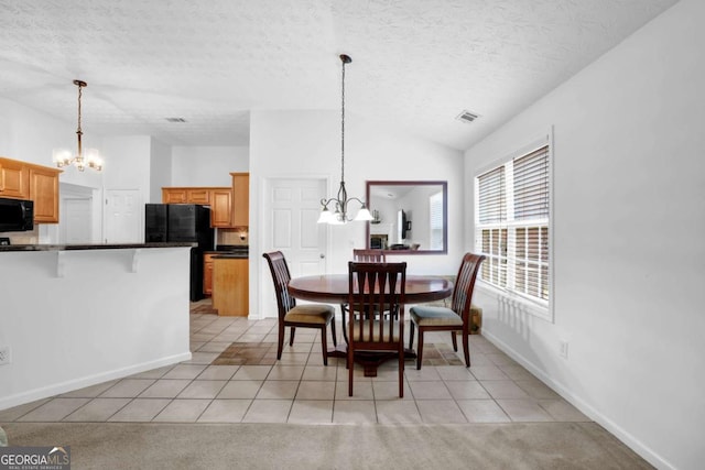 5565 Ashmoore Ct, Flowery Branch, GA 30542 - dining area with a chandelier, light tile patterned floors, lofted ceiling, a textured ceiling, and light carpet