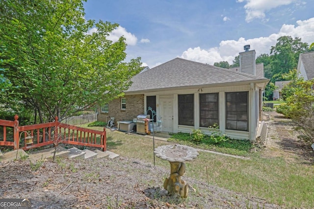 5565 Ashmoore Ct, Flowery Branch, GA 30542 - back of house with a shingled roof and a chimney