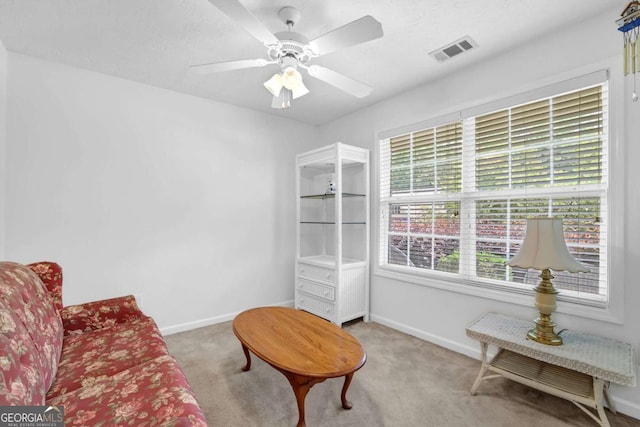 5565 Ashmoore Ct, Flowery Branch, GA 30542 - living area with carpet flooring and a ceiling fan
