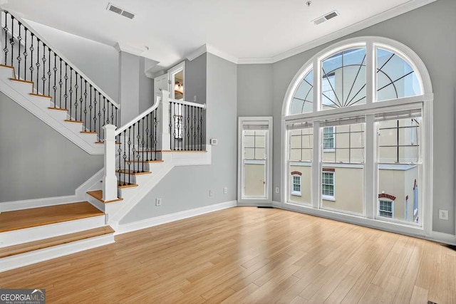 3541 Roswell Rd NE Unit 21, Atlanta, GA 30305 - foyer featuring wood finished floors, crown molding, and stairs