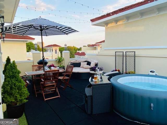 3541 Roswell Rd NE Unit 21, Atlanta, GA 30305 - view of patio with outdoor dining area and a jacuzzi