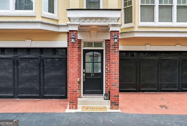 3541 Roswell Rd NE Unit 21, Atlanta, GA 30305 - entrance to property with a garage and brick siding