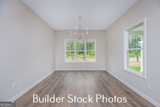 LOT6 The Rock Rd, Thomaston, GA 30286 - unfurnished dining area featuring a chandelier, healthy amount of natural light, and wood finished floors