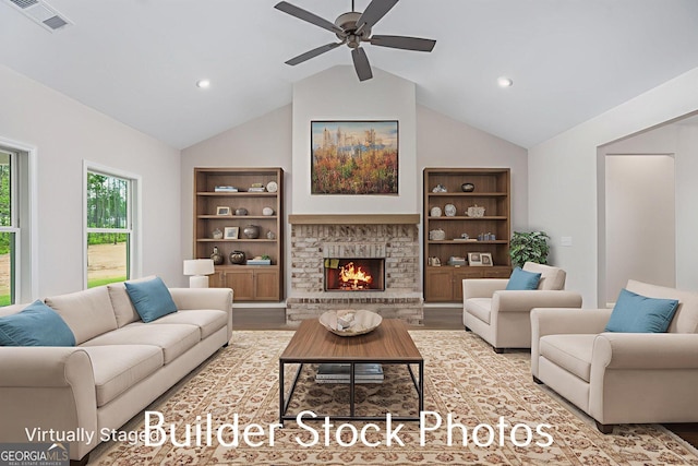 LOT6 The Rock Rd, Thomaston, GA 30286 - living room with ceiling fan, wood finished floors, lofted ceiling, a warm lit fireplace, and built in features