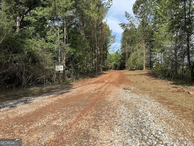LOT6 The Rock Rd, Thomaston, GA 30286 - view of dirt / gravel road featuring a forest view