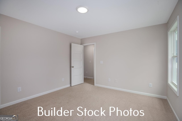 LOT6 The Rock Rd, Thomaston, GA 30286 - unfurnished bedroom featuring carpet and baseboards