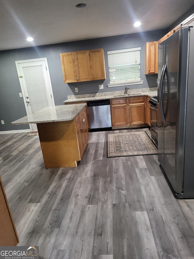 1962 Bridgestone Cir, Conyers, GA 30012 - kitchen featuring refrigerator with ice dispenser, dishwasher, dark wood finished floors, light stone countertops, and recessed lighting