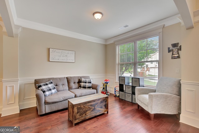 108 Village Pl, Newnan, GA 30265 - living area with crown molding, a wainscoted wall, wood finished floors, and a decorative wall