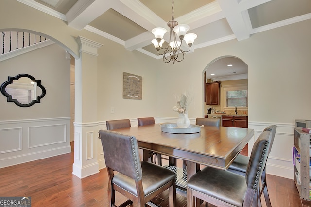 108 Village Pl, Newnan, GA 30265 - dining area featuring arched walkways, coffered ceiling, beam ceiling, a chandelier, and dark wood-style flooring