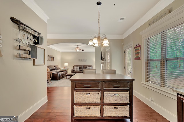 108 Village Pl, Newnan, GA 30265 - kitchen featuring ceiling fan, crown molding, a chandelier, dark wood-type flooring, and pendant lighting