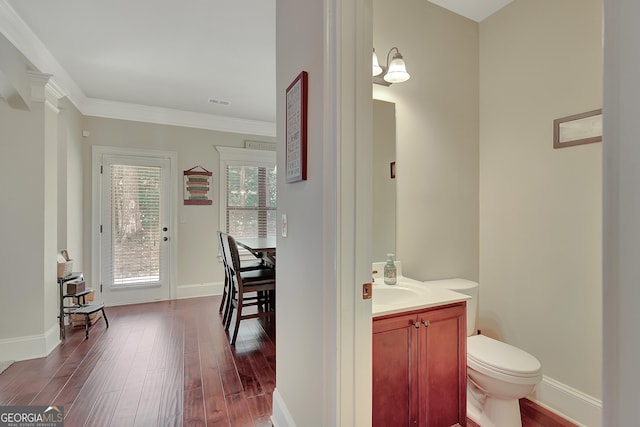 108 Village Pl, Newnan, GA 30265 - half bath featuring wood finished floors, vanity, and crown molding