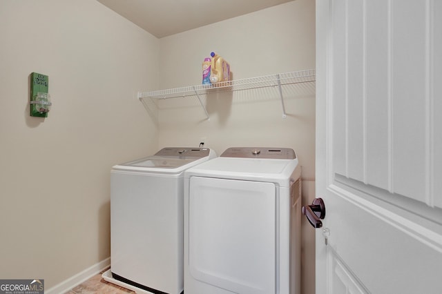 108 Village Pl, Newnan, GA 30265 - laundry room featuring washer and dryer and baseboards