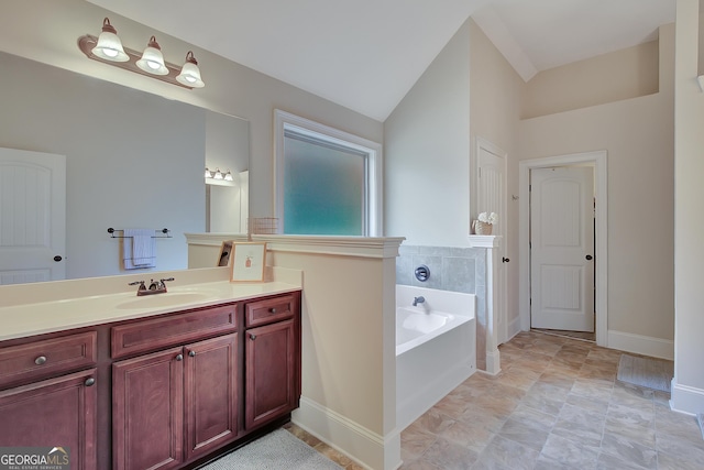 108 Village Pl, Newnan, GA 30265 - bathroom featuring a garden tub, vanity, and vaulted ceiling