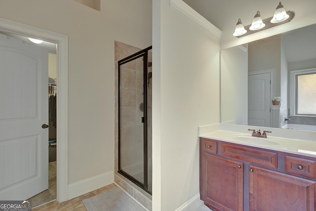 108 Village Pl, Newnan, GA 30265 - bathroom featuring a stall shower, a spacious closet, ornamental molding, and vanity