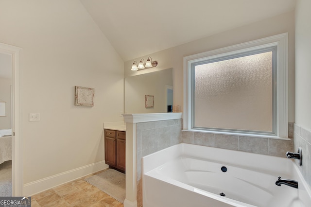 108 Village Pl, Newnan, GA 30265 - ensuite bathroom featuring vanity, a garden tub, and lofted ceiling