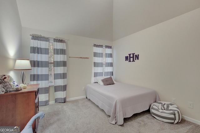108 Village Pl, Newnan, GA 30265 - carpeted bedroom with baseboards and lofted ceiling