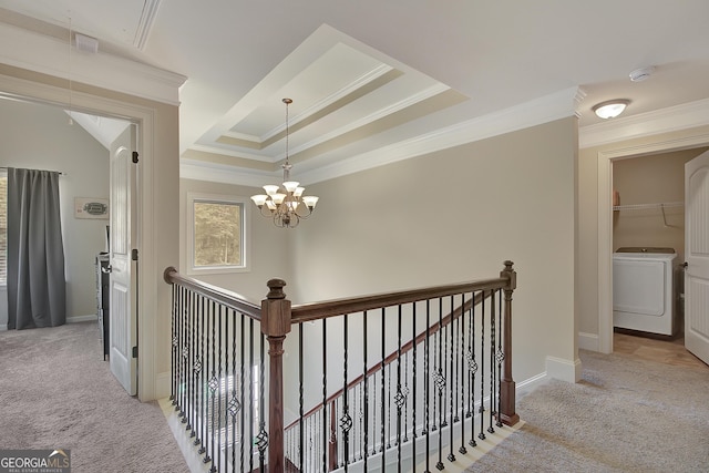 108 Village Pl, Newnan, GA 30265 - corridor with washer / dryer, an upstairs landing, carpet, ornamental molding, and a tray ceiling