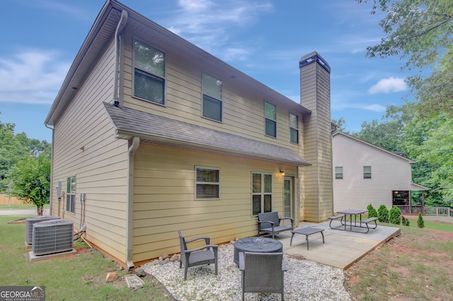 108 Village Pl, Newnan, GA 30265 - back of property featuring a patio, a chimney, and roof with shingles