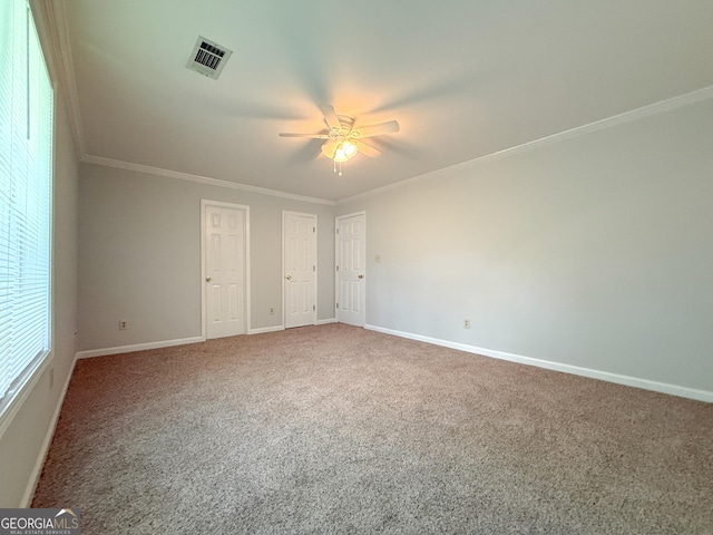 5156 Allison Way, Sugar Hill, GA 30518 - unfurnished bedroom featuring carpet floors, ornamental molding, a ceiling fan, and multiple closets