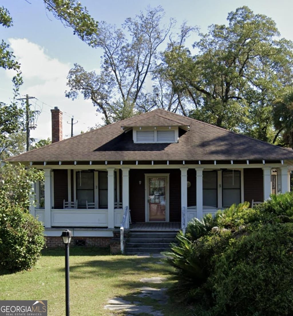 1988 Abc Ave, Waycross, GA 31501 - bungalow-style house with a chimney, a porch, a front lawn, and a shingled roof