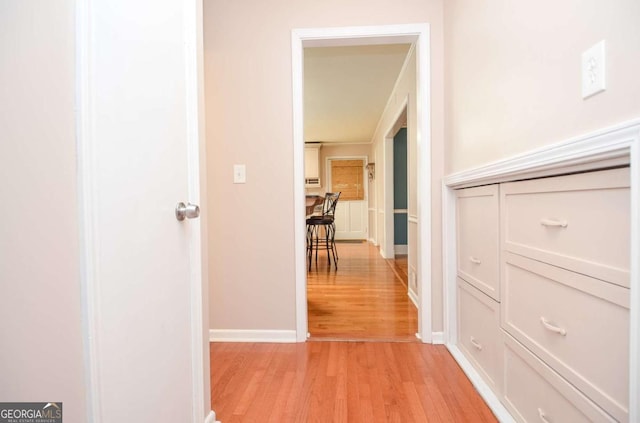 4714 Marc Ct SW, Lilburn, GA 30047 - hallway featuring light wood-style floors and baseboards