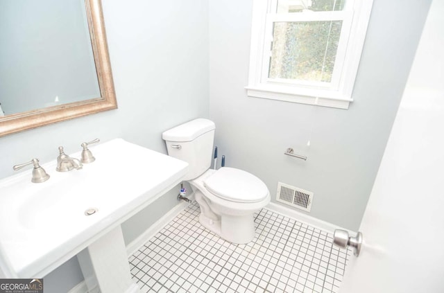 4714 Marc Ct SW, Lilburn, GA 30047 - bathroom with baseboards and tile patterned flooring