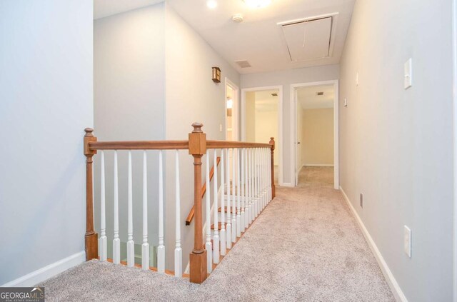4714 Marc Ct SW, Lilburn, GA 30047 - hall featuring attic access, an upstairs landing, and carpet