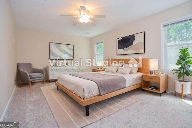 4714 Marc Ct SW, Lilburn, GA 30047 - carpeted bedroom with baseboards and ceiling fan