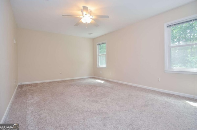4714 Marc Ct SW, Lilburn, GA 30047 - empty room with light colored carpet and ceiling fan