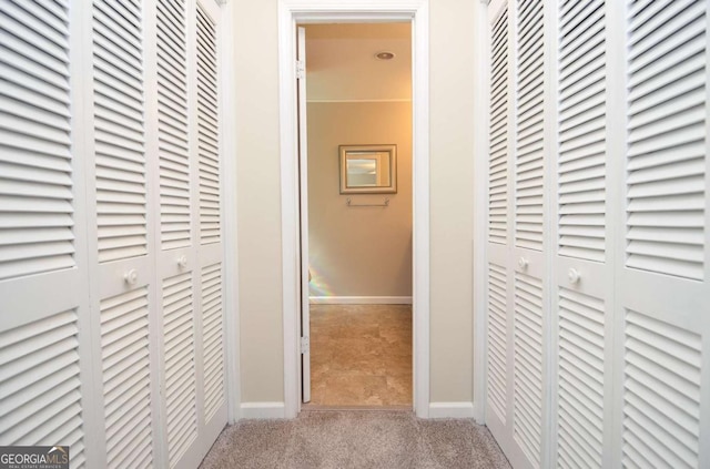 4714 Marc Ct SW, Lilburn, GA 30047 - hallway featuring carpet flooring and baseboards