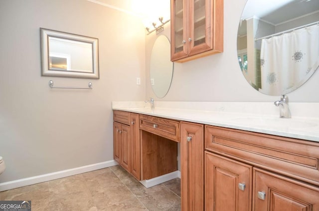 4714 Marc Ct SW, Lilburn, GA 30047 - bathroom with double vanity and ornamental molding