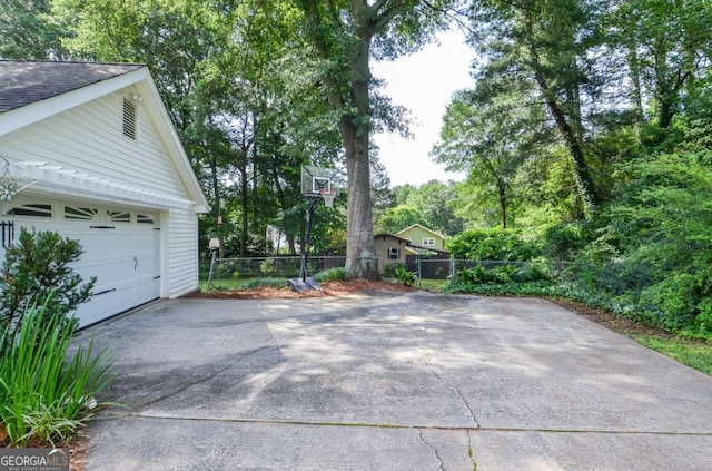 4714 Marc Ct SW, Lilburn, GA 30047 - garage with asphalt driveway
