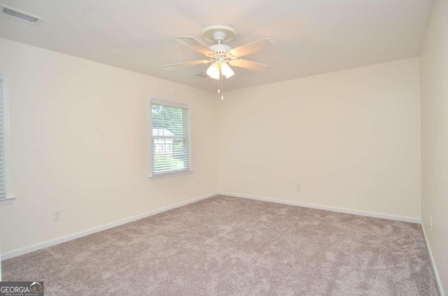 4714 Marc Ct SW, Lilburn, GA 30047 - carpeted empty room featuring a ceiling fan and baseboards
