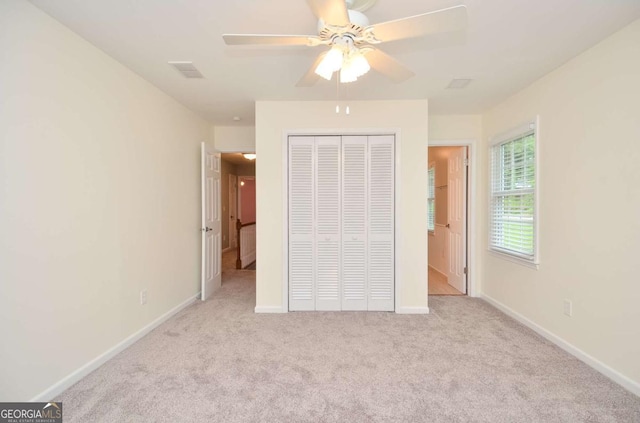 4714 Marc Ct SW, Lilburn, GA 30047 - unfurnished bedroom with carpet floors, a closet, and ceiling fan
