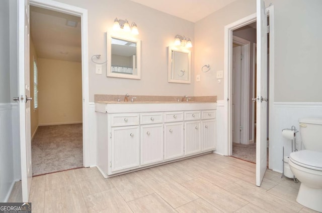 4714 Marc Ct SW, Lilburn, GA 30047 - bathroom featuring double vanity and wood finished floors