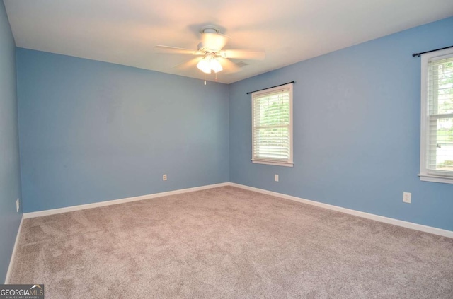 4714 Marc Ct SW, Lilburn, GA 30047 - spare room featuring carpet floors and ceiling fan