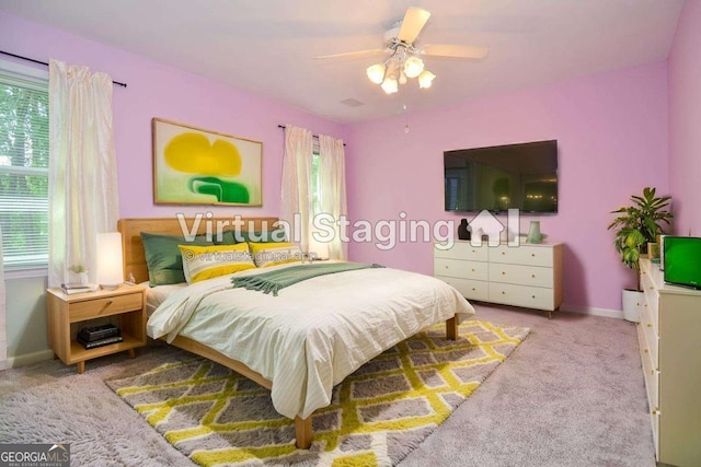 4714 Marc Ct SW, Lilburn, GA 30047 - carpeted bedroom featuring baseboards and ceiling fan