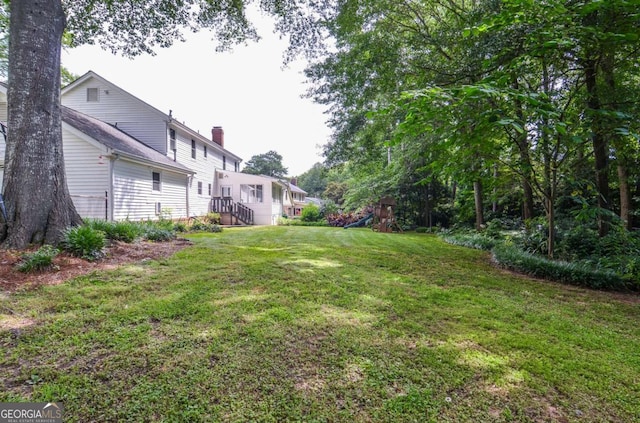 4714 Marc Ct SW, Lilburn, GA 30047 - view of green lawn featuring a playground