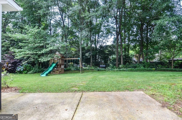 4714 Marc Ct SW, Lilburn, GA 30047 - view of grassy yard featuring a playground