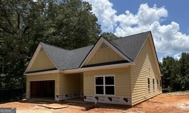 103 New Home Rd, Rockmart, GA 30153 - view of front of home with a garage, board and batten siding, and driveway