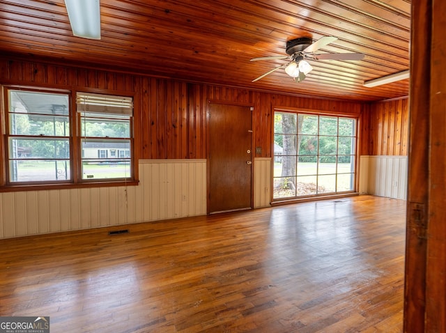 290 Mcree Dr, Camilla, GA 31730 - foyer featuring wooden ceiling, a ceiling fan, wooden walls, and wood finished floors