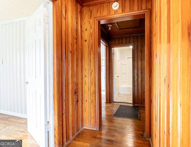 290 Mcree Dr, Camilla, GA 31730 - corridor with wooden walls and hardwood / wood-style floors